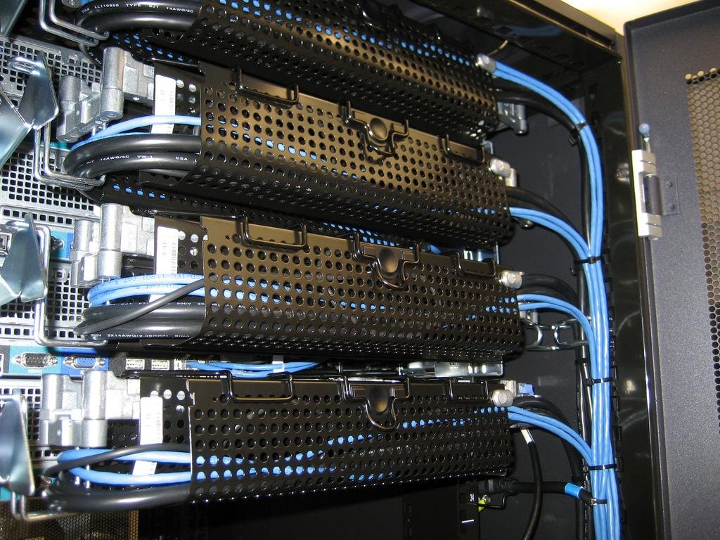 TSG Security team installing network rack infrastructure